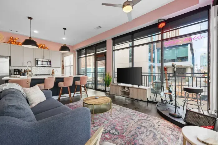 After a busy day exploring Nashville, relax on our comfy sofa in the living room.