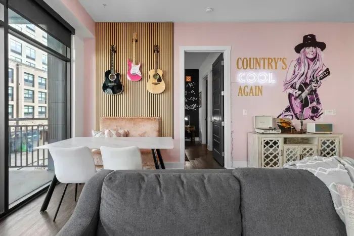 Check out our guitar wall corner booth where you can enjoy music on vinyl, and look out towards the Ryman!