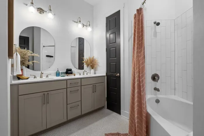 The bathroom to the Miranda bedroom, complete with double sinks and a bathtub shower combo.