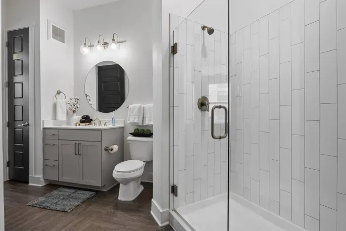 The bathroom to the Morgan bedroom -- a single sink and a walk in tile shower.