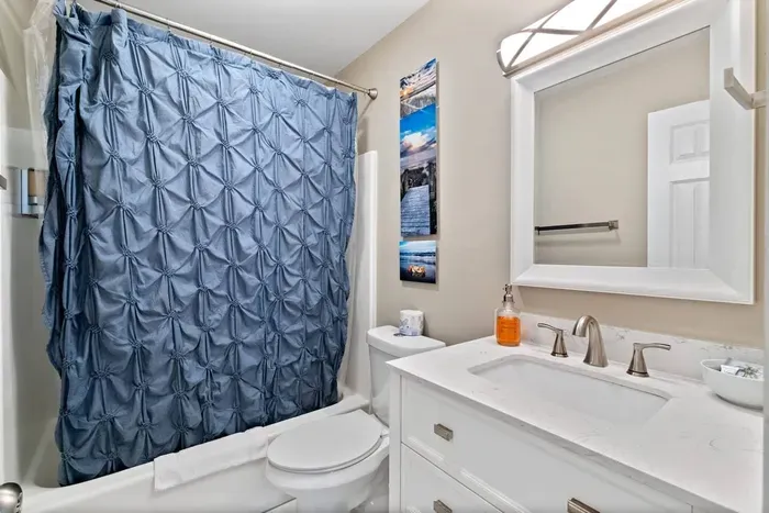 Bathroom with tub. Perfect for those post beach baths. Connected to second bedroom
