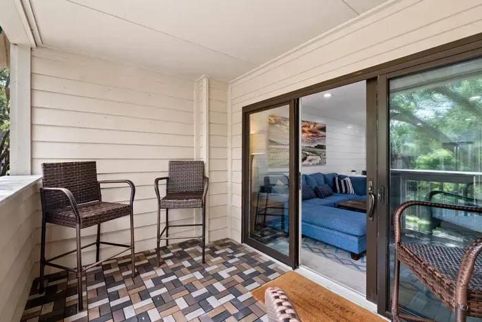 Glass door separates the balcony and living room