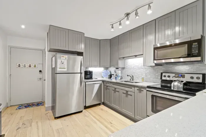 Bright modern kitchen with stainless appliances and stylish finishes