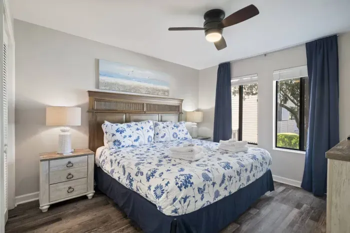 Primary Bedroom with a king-size bed and curtains for privacy and darkness when desired.