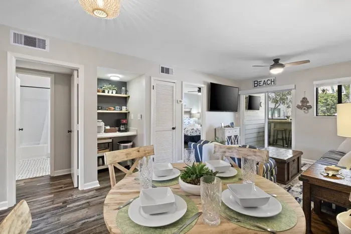 A stylish dining table and chairs are strategically placed.
