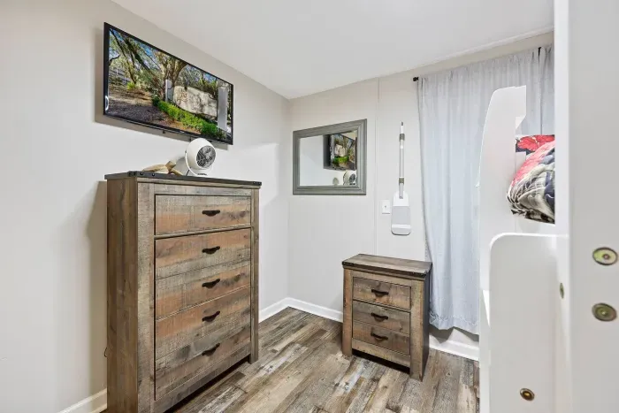 Second Bedroom Smart TV mounted on the wall for entertainment and relaxation