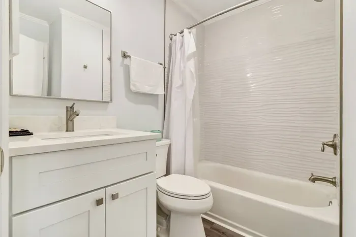 Updated bathroom, with a tub for family convenience.
