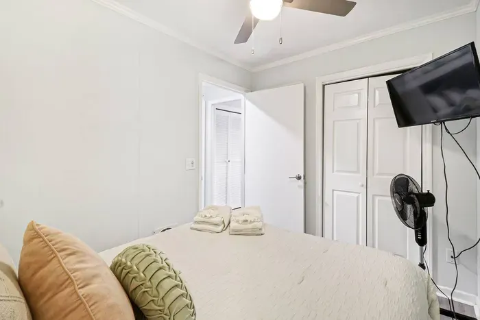 Adorned with high-quality linens, plump pillows,  the bed promises a haven of comfort and rest.