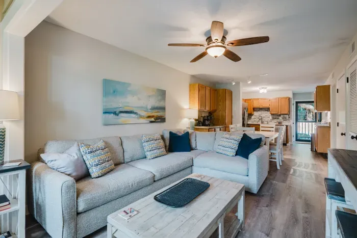 Sink into the sectional and you can still talk to whoever's cooking. Open-concept living, dining, and kitchen means nobody's stuck alone in another room.