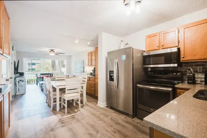 Full-size everything — side-by-side fridge with ice and water, range, microwave, dishwasher. Cook a real dinner instead of eating out every night.