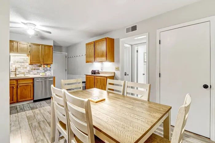 Comfortable and chic dining chairs surround the table, providing ample seating for guests.