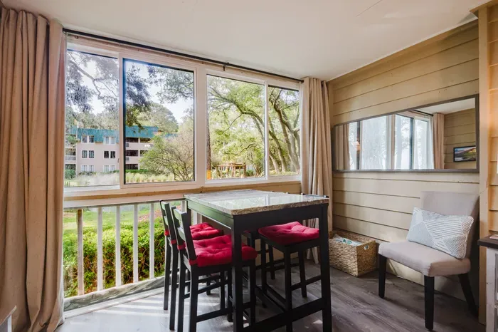 Coffee at sunrise, cards at sunset, wine whenever. Four seats at the window with nothing but trees and water in front of you.