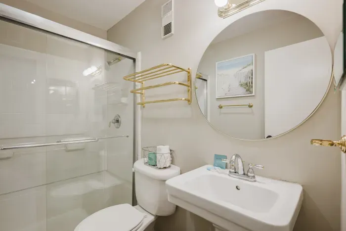 Full tub-shower in the second bath — the one that makes traveling with kids workable. Two full baths, no morning bottleneck.