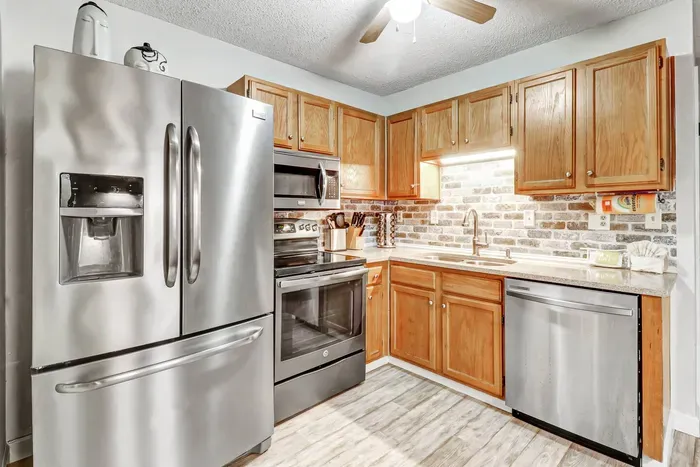 The kitchen are equipped with modern appliances.