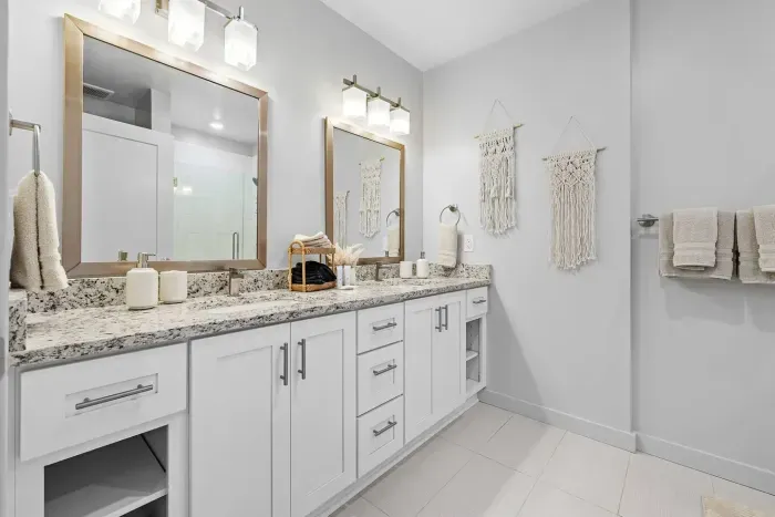 The bathroom to the Fast Lainer bedroom, complete with double sinks and a tile shower.