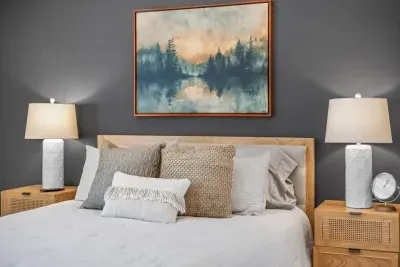 Beautifully decorated primary suite with plush bedding and high quality linens to ensure a restful night's sleep.