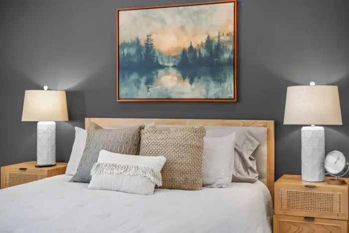 Beautifully decorated primary suite with plush bedding and high quality linens to ensure a restful night's sleep.