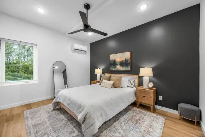 Spacious primary bedroom on the second floor of the townhouse.