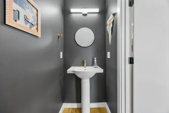 Half bathroom just off the dining area on the first floor.