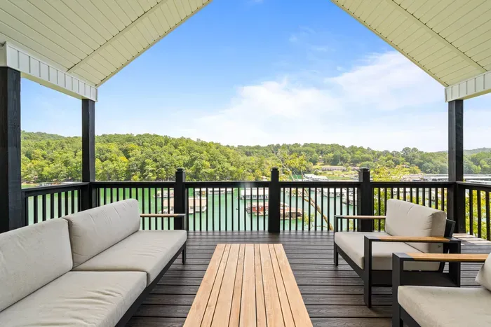 Morning coffee, afternoon shade, and Norris Lake in every direction. This deck is where your group will spend most of the trip.