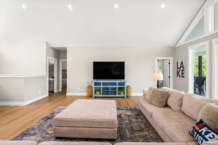 Big screen for rainy afternoons and game nights, with a two bedrooms and bathrooms just off the room.