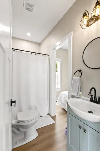 Another full bath serving a bedroom directly. Six bathrooms total means nobody's waiting their turn.