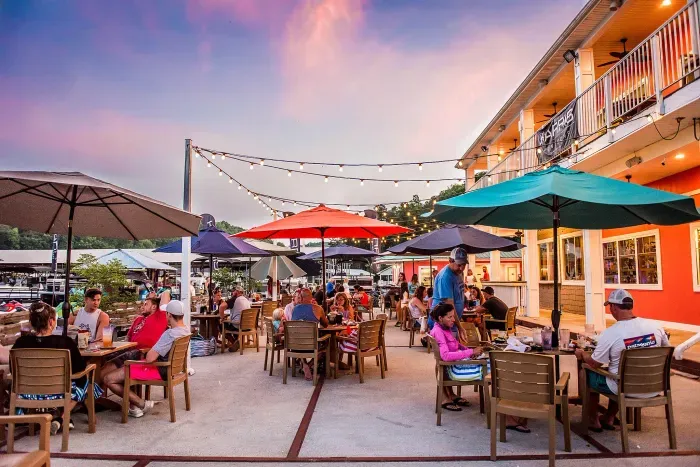 Sunset dinners at Shanghai Resort Marina — string lights, lake breeze, and no one has to cook. Just a short ride from the house.