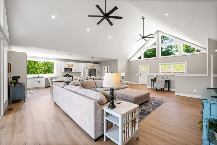 Kitchen, dining, and living all under one vaulted ceiling. Everyone stays in the same room without being on top of each other.