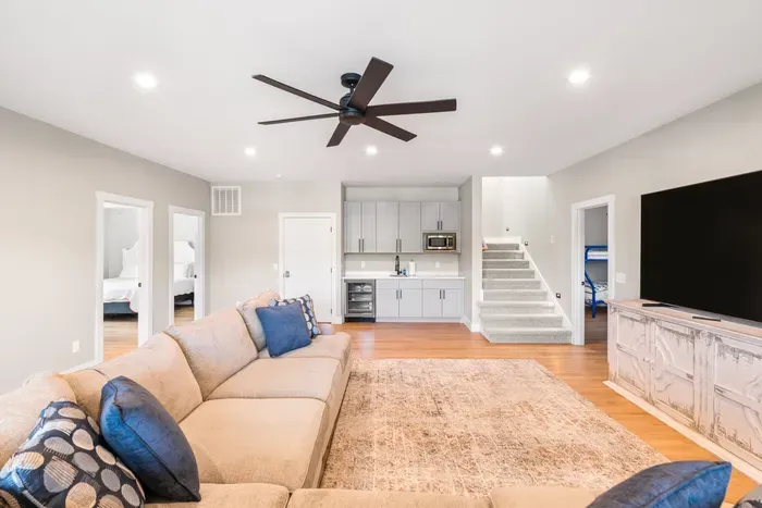 Wet bar with beverage fridge and microwave, plus bedrooms and a bunk room right off the room. The kids' floor, effectively.