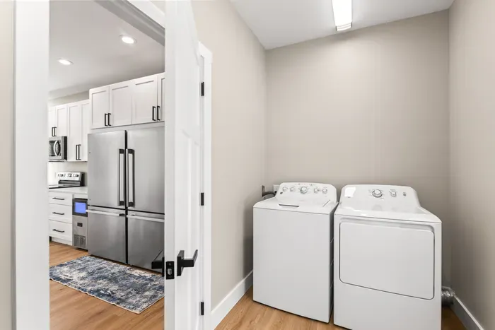 Full-size washer and dryer just off the kitchen, alongside the second fridge and ice maker. Pack lighter and wash mid-week.