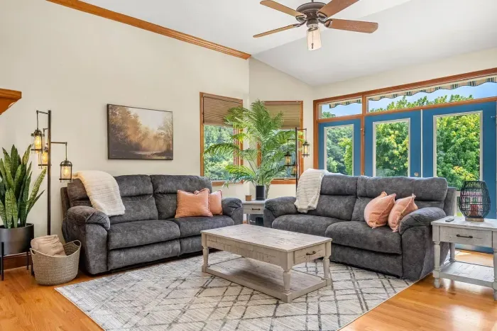 Cozy up on the sofa or loveseat in the living room by the fireplace or take in the beautiful lake views from the wall to wall doors.