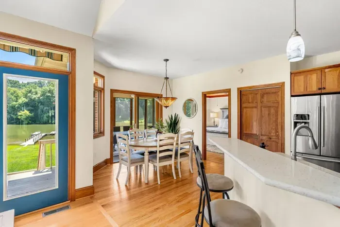 Dining area with additional seating in the sunroom.