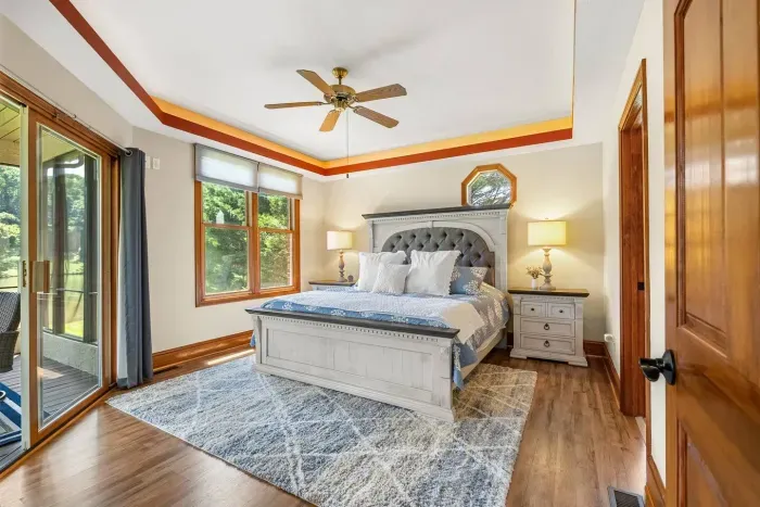 The spacious master bedroom with access to the sunroom.