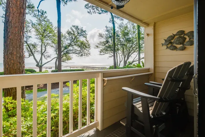Two Adirondack glider chairs and a bar-height ledge on the covered balcony. Watch the sunrise and boats passing by every morning and end the day at sunset.