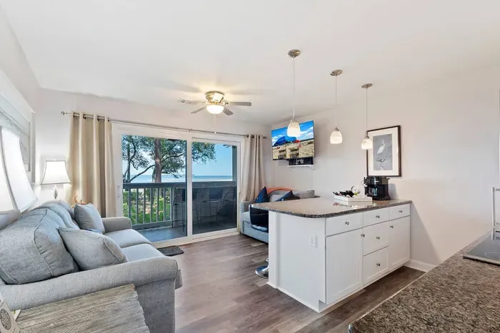 Nice sleeper sofa in living room and open floor plan.  All TVs are smart ready fro you to enjoy your favorite streaming programs.