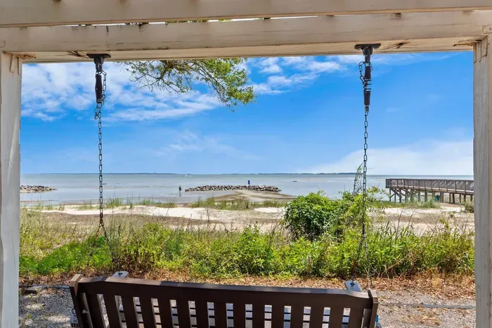 Stop by on the lovely bench the amazing view of the beach