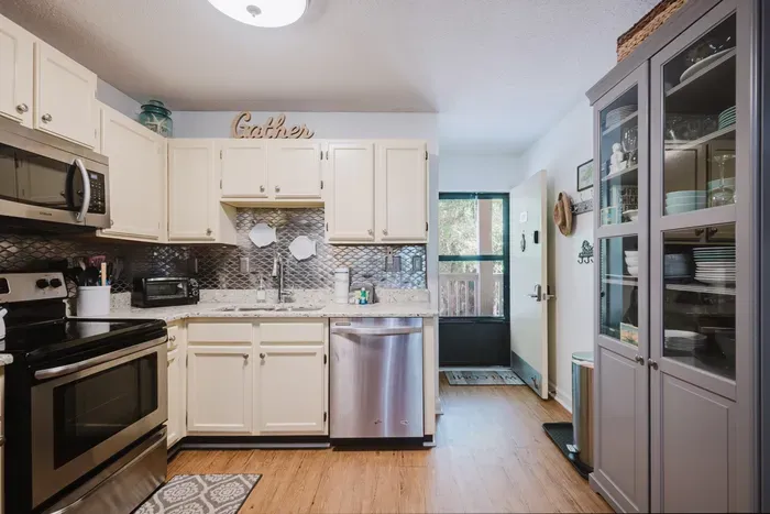 Bright kitchen with stainless appliances and plenty of storage