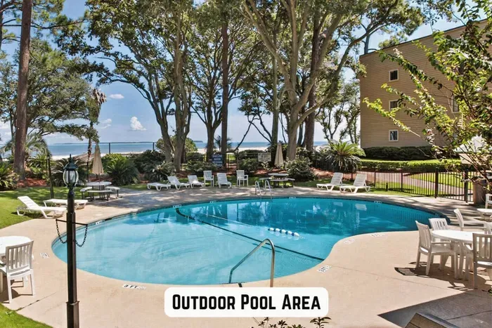 A serene and inviting outdoor pool area near a beach