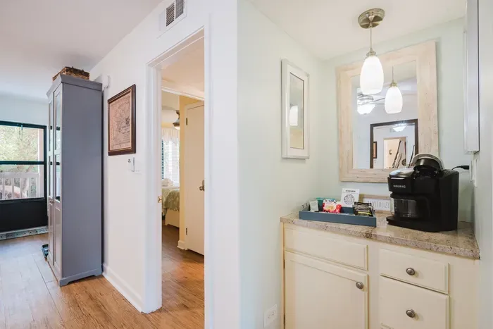 Bright hallway coffee station with Keurig and charming, cozy details
