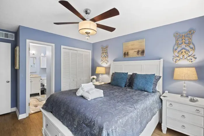 The room has an entryway to a smaller, matching bathroom