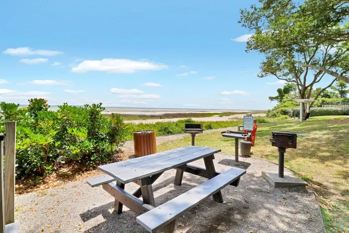 Picnic Table with outdoor charcoal grills.