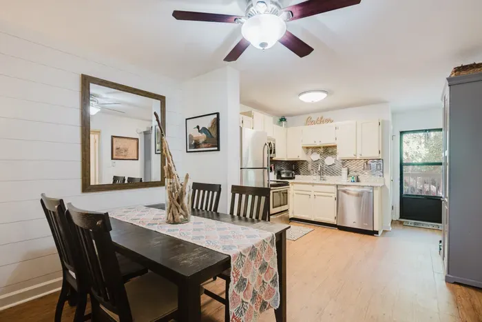 Bright open dining area and stylish kitchen with seating for four