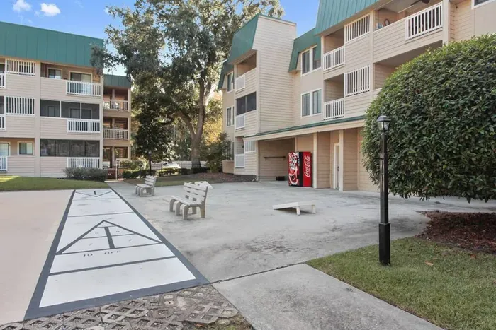 Shuffle Board and Corn Hole games around outdoor pool 2.