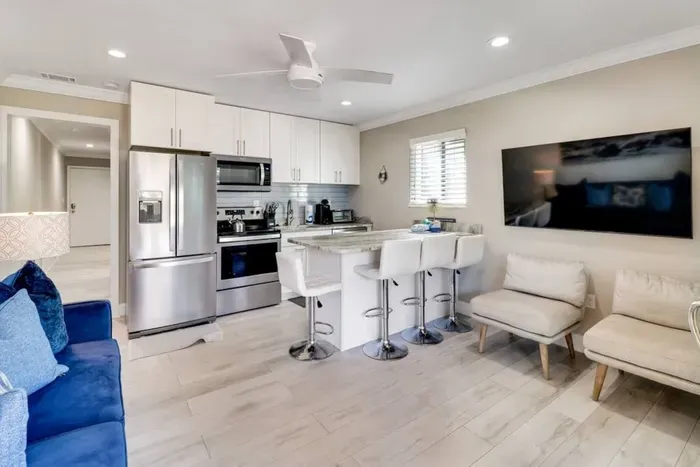 Extra seating with Sofa and two chairs and Smart TV.