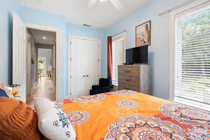 Looking down the bedroom hall toward the great room and screened porch beyond.