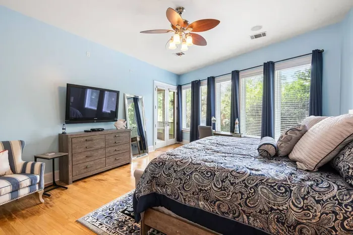 Windows down the whole wall, a private porch door, and a desk if you need one.