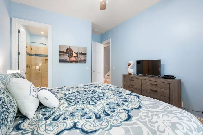 Main floor king bedroom with a smart TV and an en suite bath just through the door.