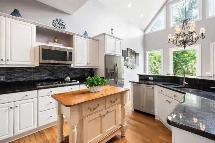 Vaulted ceilings and windows over the sink. Even the dishes come with a view.