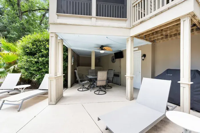 Covered lower patio with dining for six, a TV, and the grill. Shade when you need a break from the sun.