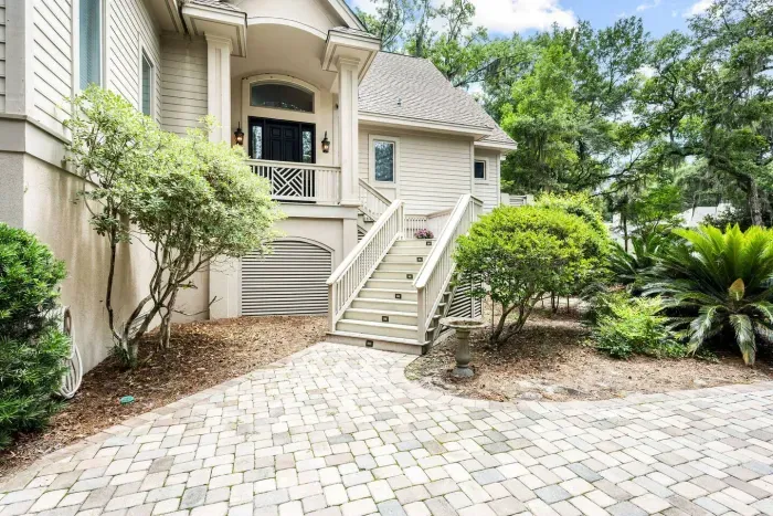 Paver courtyard and front steps. Please note the main living level is up a full flight of stairs.